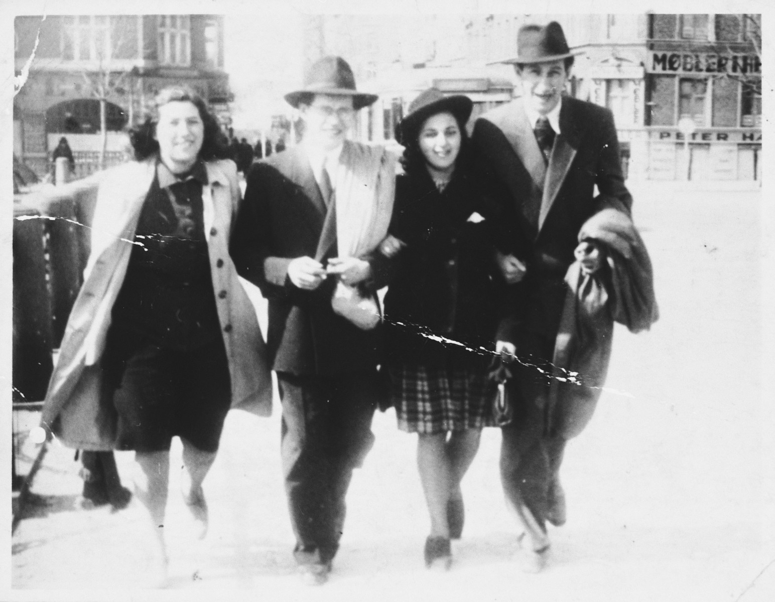 Four young Jewish men and women walk along the Fredriksgade in downtown Copenhagen during the German occupation.

Pictured from left to right are: Esther Diament, David Nussbaum, Leila Altschuler, and Jac. Kransnik.