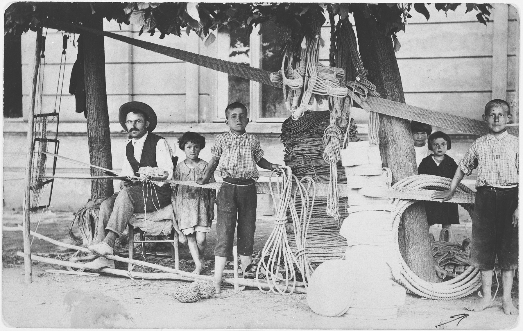 Moshe Lowy apprentices as a rope maker in the workshop of Mikhailo Radosavljevich.