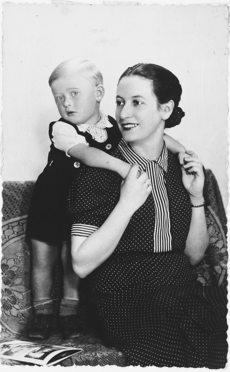 Portrait of a little boy with his mother. 

Pictured are Leszek, who perished in Auschwitz in 1943, and his mother, Helen Israel, who survived the war.