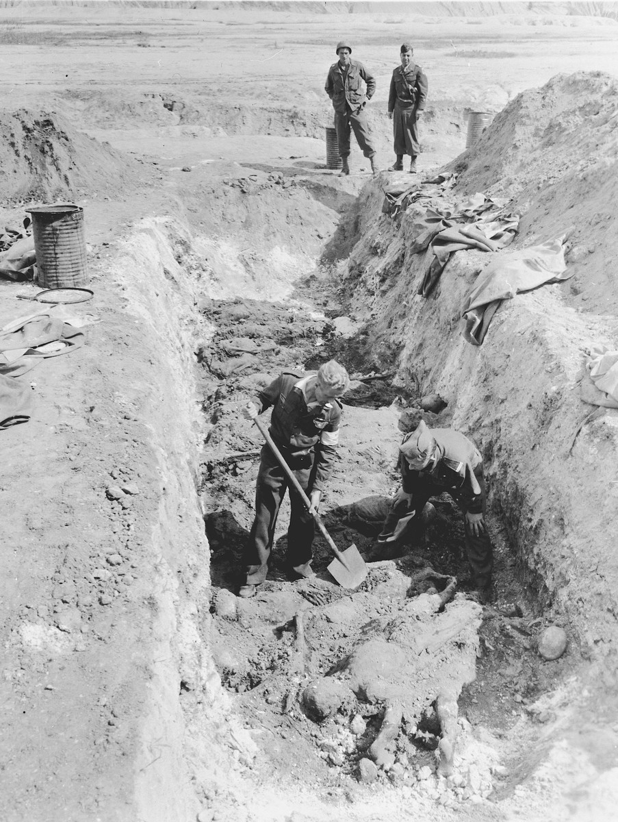 Under the direction of American soldiers, German civilians exhume the bodies of prisoners from a mass grave 14 km. east of Zeitz.

On June 18, 1945, the 7th U.S. Army, 69th Infantry Division was notified about a mass grave near Zeitz.  The grave was discovered by a Dutch soldier who had been a prisoner for three years in the nearby labor camp of Troeglitz, a sub-camp of Buchenwald.  The 400 victims exhumed from the grave were also prisoners of Troeglitz, which provided labor for Brabag (Braunkohle-Benzin AG).  All the victims were male and without identification, except for a few with numbers on their tattered and partly decayed clothing. Civilians from the area claimed that the bodies were buried just before the arrival of U.S. Army troops.