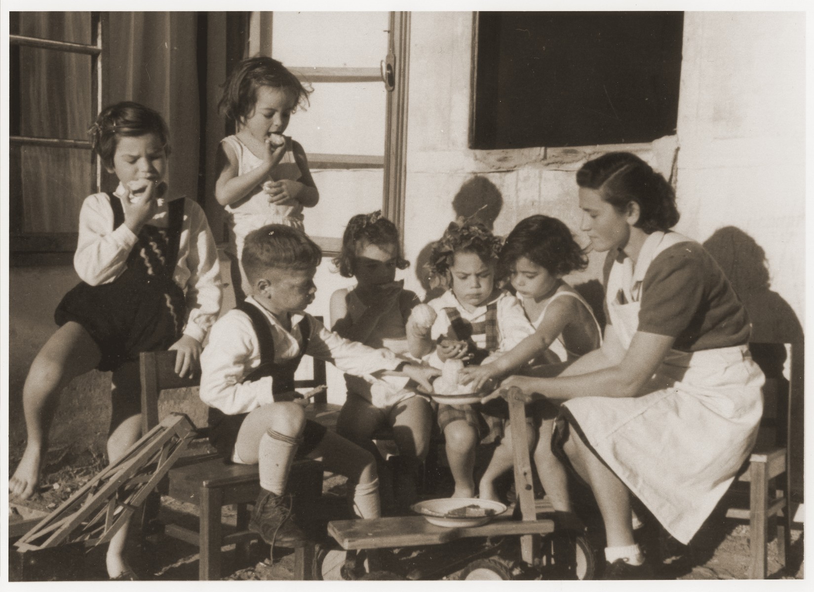 Young children engaged in an activity at the children's home in the Backnang displaced persons' camp.