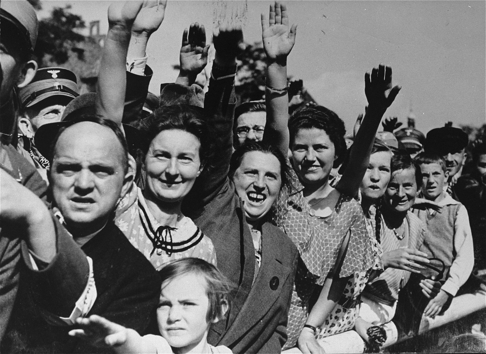 German spectators give the Nazi salute as they watch a Reichsparteitag (Reich Party Day) parade in Nuremberg.