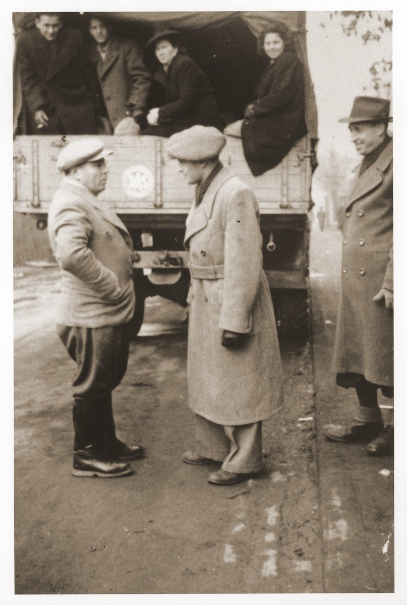 DPs riding on the back of a truck leave the Belsen displaced persons camp for France, where they will sail aboard the Exodus 1947 to Palestine.

Szaja Aron Knobler (now Alex Knobler) is the son of Moszek and Jocheta Knobler.  He was born in 1921 in Bedzin, Poland.  Szaja had three older sisters, Ita, Esther and Leah.  In 1931 the family moved to Chorzow near the German border.  There Szaja became active in the Akiba Zionist youth movement.  In 1938 he joined the Akiba hachshara [agricultural training farm] in Bielsko and made plans to immigrate to Palestine.  His plans were thwarted, however, by the start of World War II.  In the first months of the war Szaja fled to the Soviet sector of Poland, where he explored possible exit routes to Palestine via Romania for the nascent Zionist underground.  During a visit home in 1940 Szaja was caught up in the forced resettlement of his family to the Sosnowiec ghetto.  From Sosnowiec Szaja was deported to the Blechhammer labor camp, where he remained until the camp was evacuated in January 1945.  During the forced march out of the camp Szaja ran away with two friends.  German guards shot and killed his friends but Szaja escaped.  Posing as a Polish laborer, Szaja found refuge with a German farmer in Gleiwitz until liberation.  After the war Szaja, who was the sole survivor of his immediate family, took a leading role in the setting up of Zionist collectives in Poland.  He also was active in the Bricha and Aliyah Bet [illegal immigration to Palestine] movement.  This activity led to his arrest in Sosnowiec by the NKVD.  Following his release from prison, Szaja left Poland for Germany.  During the summer of 1945 Szaja organized Zionist activities at the Foehrenwald displaced persons camp.  In October he moved on to the Bergen-Belsen DP camp, where he joined a group of 400 would-be immigrants to Palestine.  The group sailed aboard the Tel Hai from Marseilles in March 1946.  When the ship reached Palestine, it was intercepted by the British and its passengers interned for three weeks in Athlit.  Following his release Szaja settled in Kibbutz Masada, but by December 1946 he was back in Germany.  Serving as an emissary for NOHAM (Noar Halutzi Meuchad), a Zionist youth umbrella group, Szaja distributed immigration certificates and organized Youth Aliyah groups in the DP camps.  While working at the Belsen DP camp Szaja met Pola Blicblum, a survivor from Lodz.  They were married in the Landsberg DP camp on July 30, 1947.  Soon after they settled in Palestine.