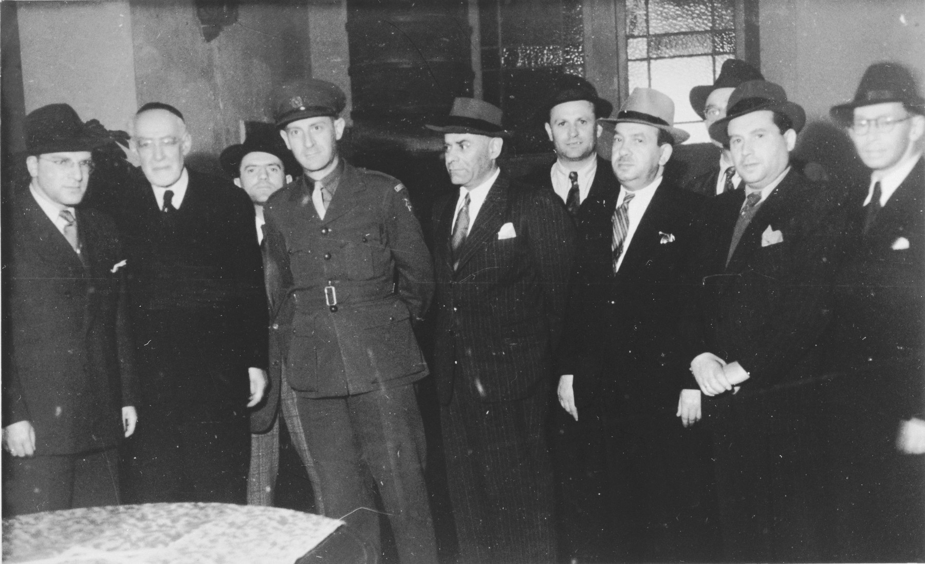 Rabbi Leo Baeck poses with a group of Jewish leaders during his three week visit to Germany.  Norbert Wollheim stands at the far left next to Baeck.

Baeck was greeted at the airport by Norbert Wollheim, Chairman of the Central Committee of Jews in the British Zone.  Baeck's trip included participation in an evangelical congress in Darmstadt on October 12, as well as numerous appearances before local Jewish communities.