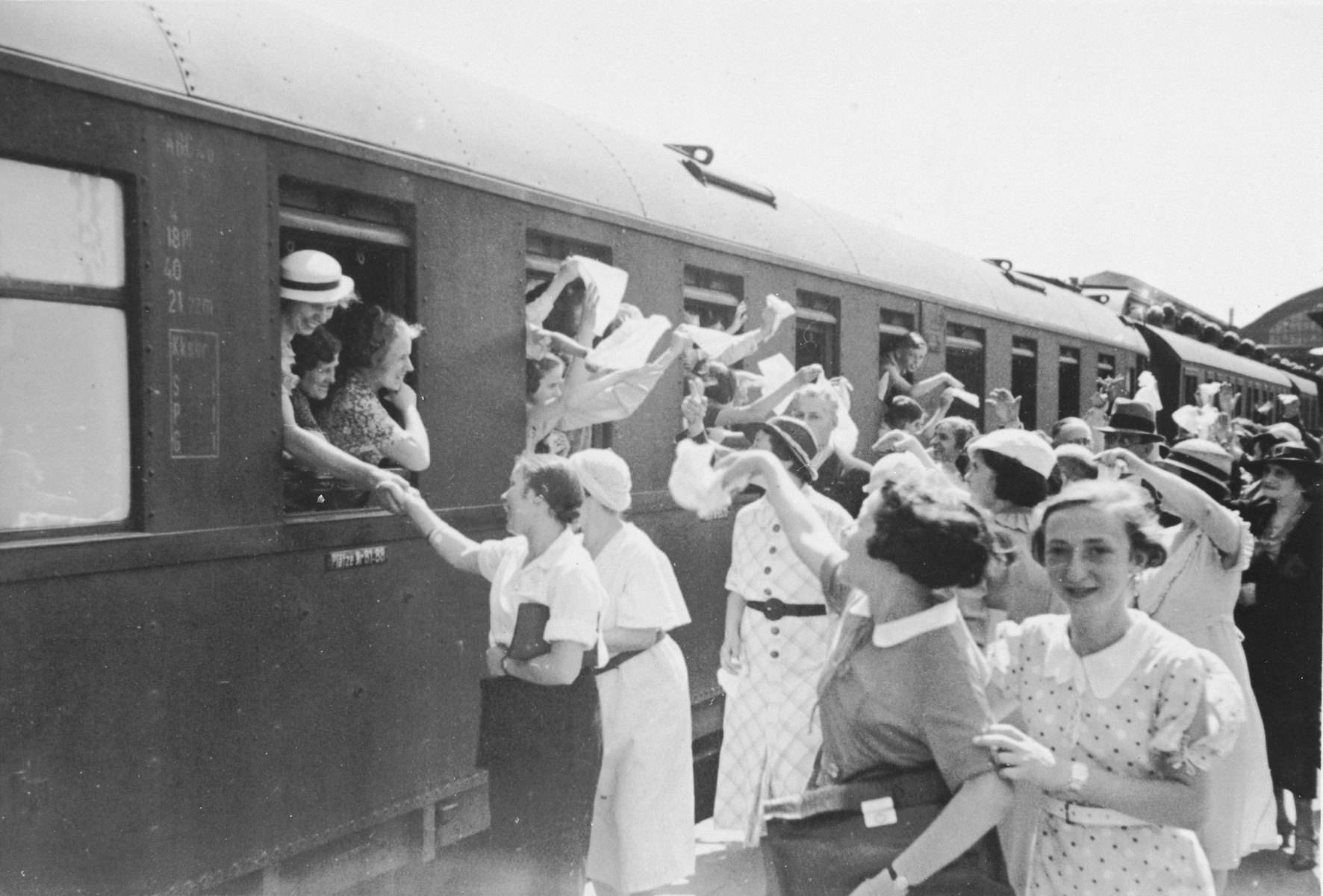 Jewish children from Germany depart by train from a Kinderlager [children's recreational summer camp] in Horserod, Denmark. 
 
In 1935-36 Norbert Wollheim was involved in organizing groups of German Jewish youth to attend a summer camp in Denmark.