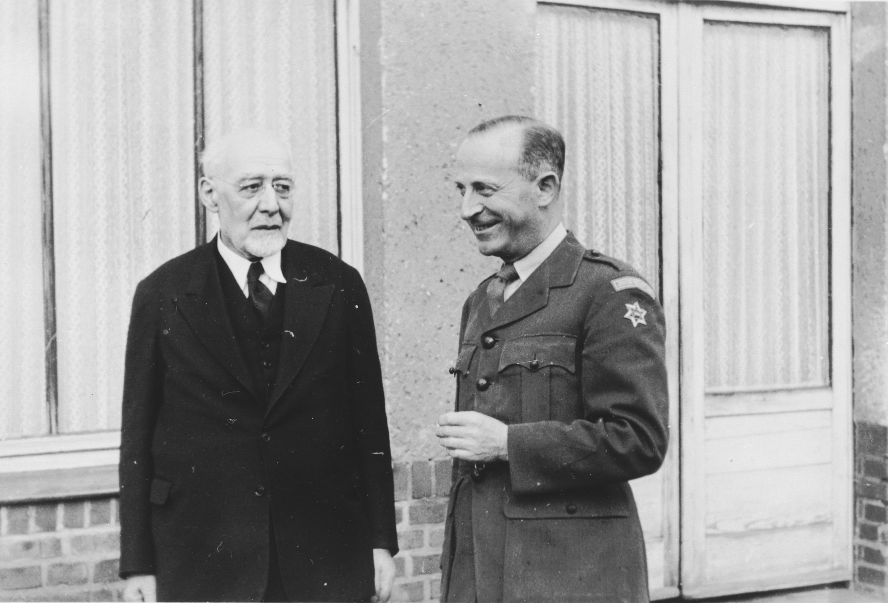 Rabbi Leo Baeck (left) poses with Ernst G. Lowenthal (right) during his three week visit to Germany.

Baeck was greeted at the airport by Norbert Wollheim, Chairman of the Central Committee of Jews in the British Zone.  Baeck's trip included participation in an evangelical congress in Darmstadt on October 12, as well as numerous appearances before local Jewish communities.

Ernst G. Lowenthal was born in Koln, Germany in 1904.  After receiving his doctorate in sociology, he worked for the Central Association of German Citizens of the Jewish Faith from 1929 to 1938.  He also edited the Journal for the History of the Jews in Germany.  In 1939 he immigrated to England.  A year after the war he returned to Germany, where among other roles, he served as director of the Jewish Relief Unit in the British Occupation Zone from 1947 to 1948.
