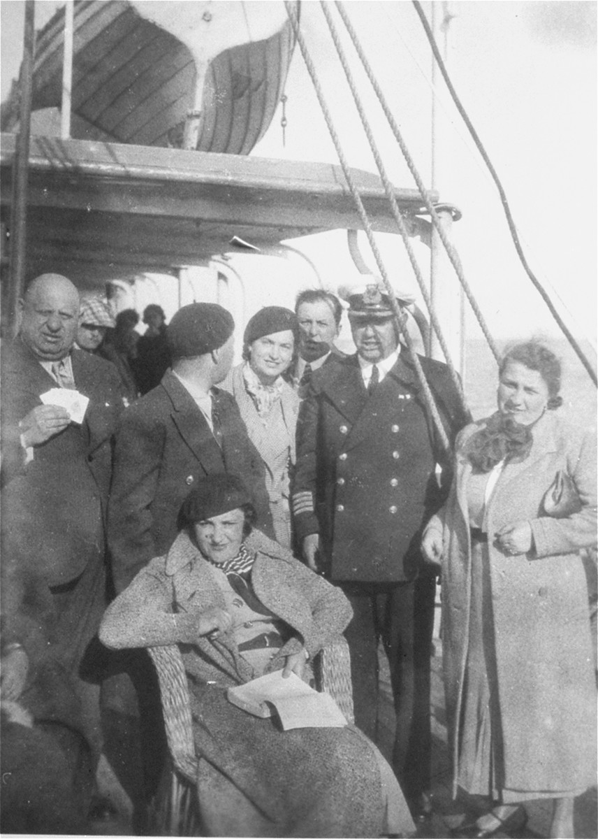 Jewish couples from the Balkans on board a ship during a sightseeing excursion to Palestine.

Among those pictured are Beno and Blanka Kupfermann (center, behind the seated woman).