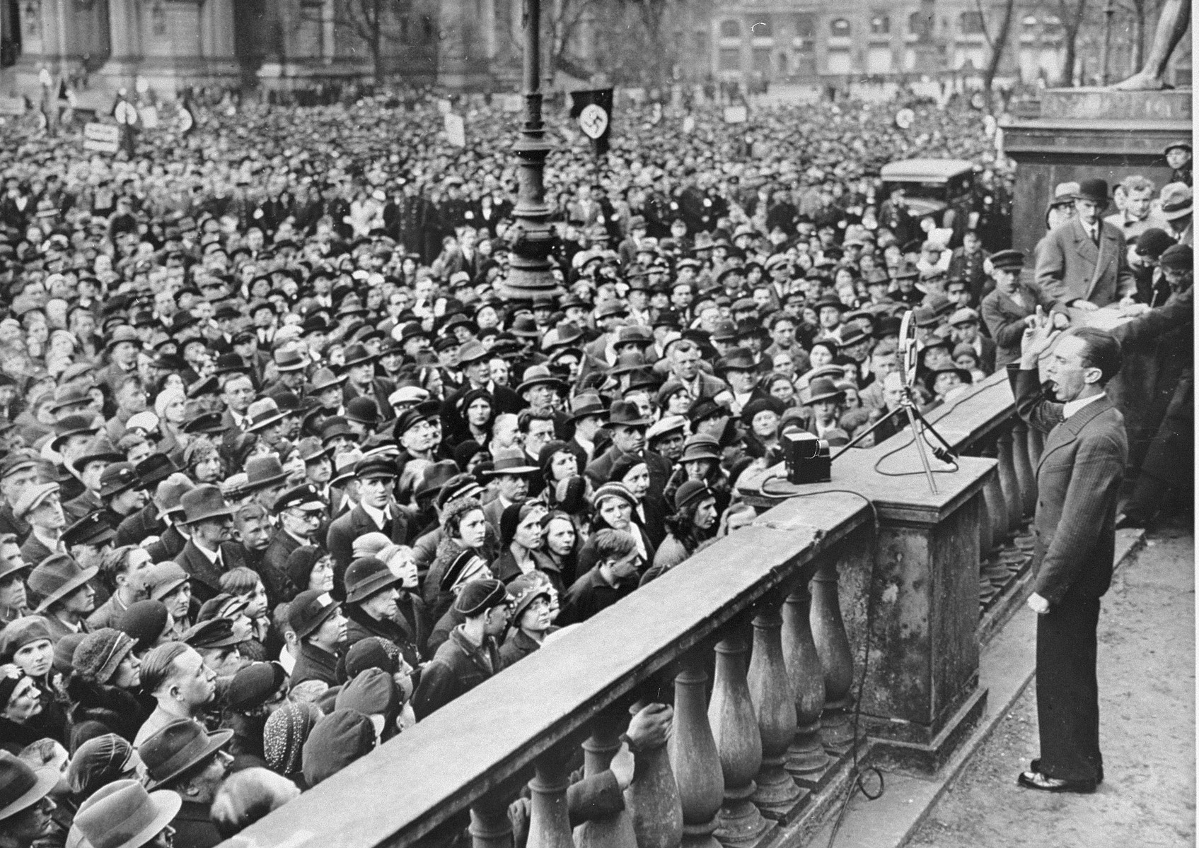 Reichsminister Joseph Goebbels delivers a speech to a crowd in the Berlin Lustgarten urging Germans to boycott Jewish-owned businesses.  He defends the boycott as a legitimate response to the anti-German "atrocity propaganda" being spread abroad by "international Jewry."