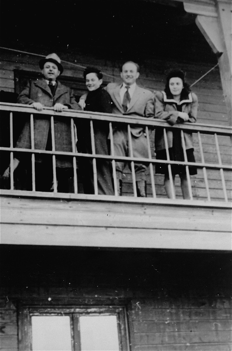 Andzia Dell and three other DPs watch a ball game from a balcony in Schlachtensee displaced persons camp.