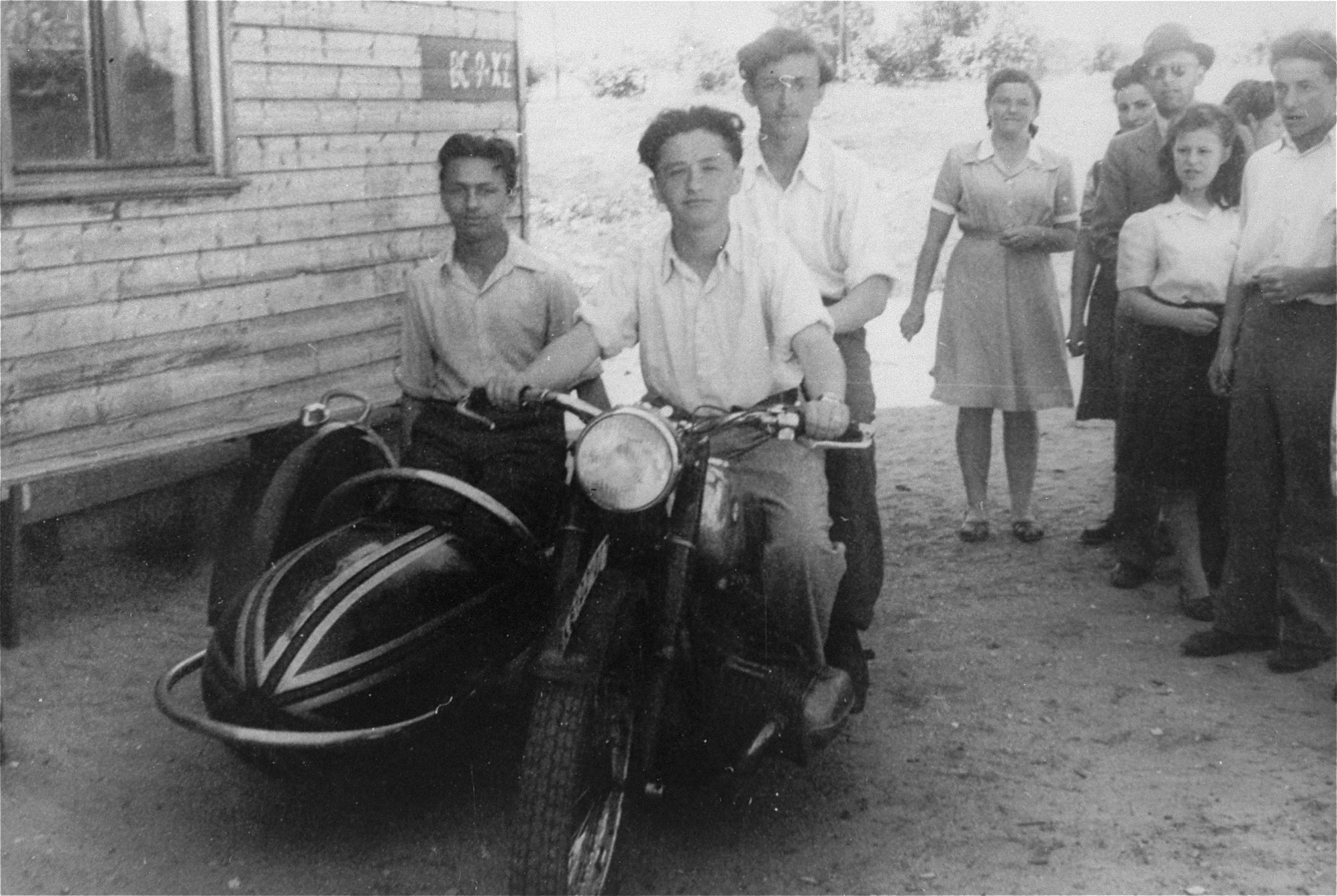 Moniek Gliklich drives a motorcycle in the Schlachtensee displaced persons camp.