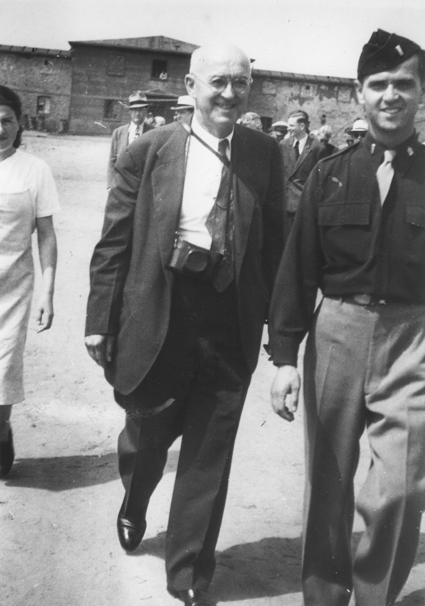 U.S. Army chaplain Rabbi Mayer Abramowitz (right) escorts a member of a visiting international commission in the Schlachtensee displaced persons camp.