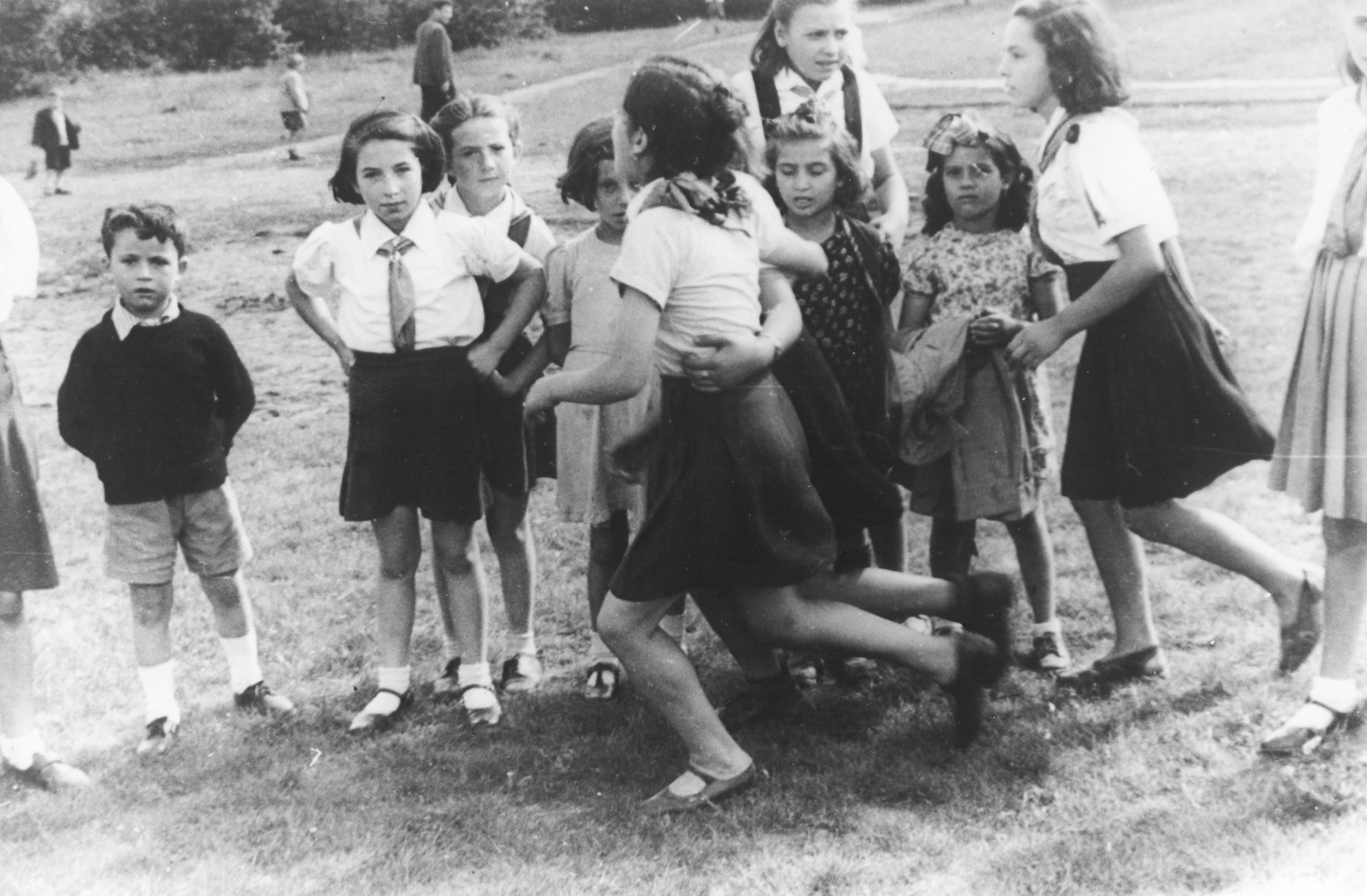 A group of  young Jewish girls play outside in a summer camp for Jewish DP children in the Grunewald Forest.