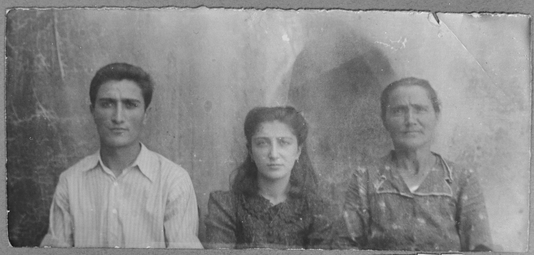 Portrait of Sol Hasson, wife of Avram Hasson, Isak Hasson, son of Avram, and Rahel Hasson, daughter of Avram.  Isak was a tailor and Rahel, a student.  They lived at Sinagogina 6 in Bitola.