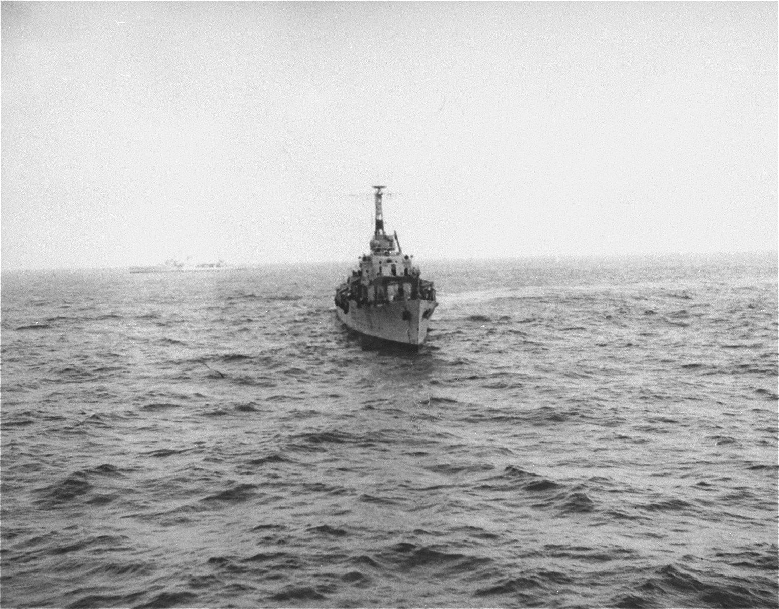 A British warship that has been dispatched to prevent the landing of the Exodus 1947, approaches the illegal immigrant ship off the coast of Palestine.