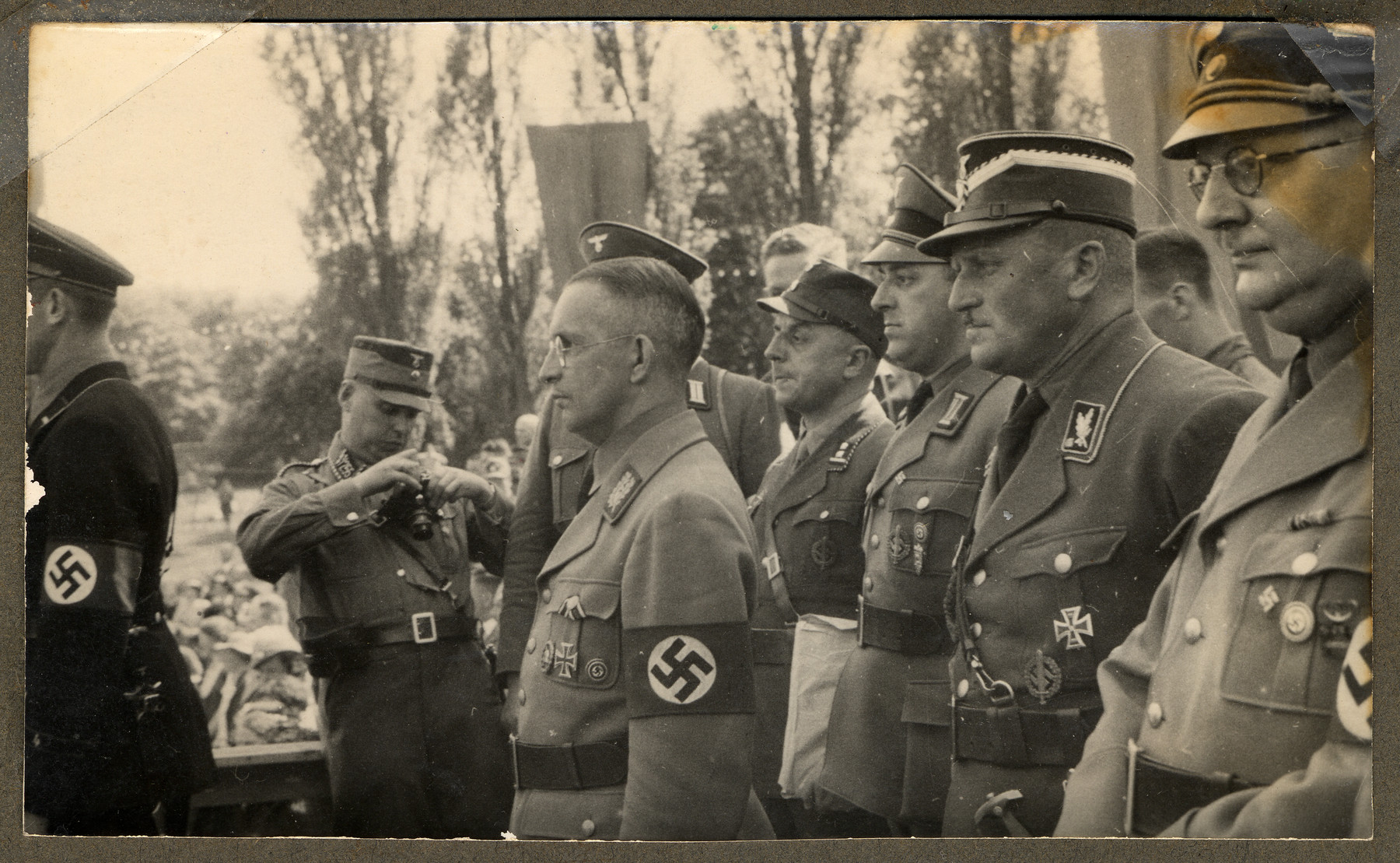 Nazi military officials meet at Gronau, a German town on the border of the Netherlands.

In profile, third from left, is Dr. Alfred Meyer, Gauleiter of Westfalen-Nord and future State Secretary in the Reich Ministry for the Occupied Eastern Territories.