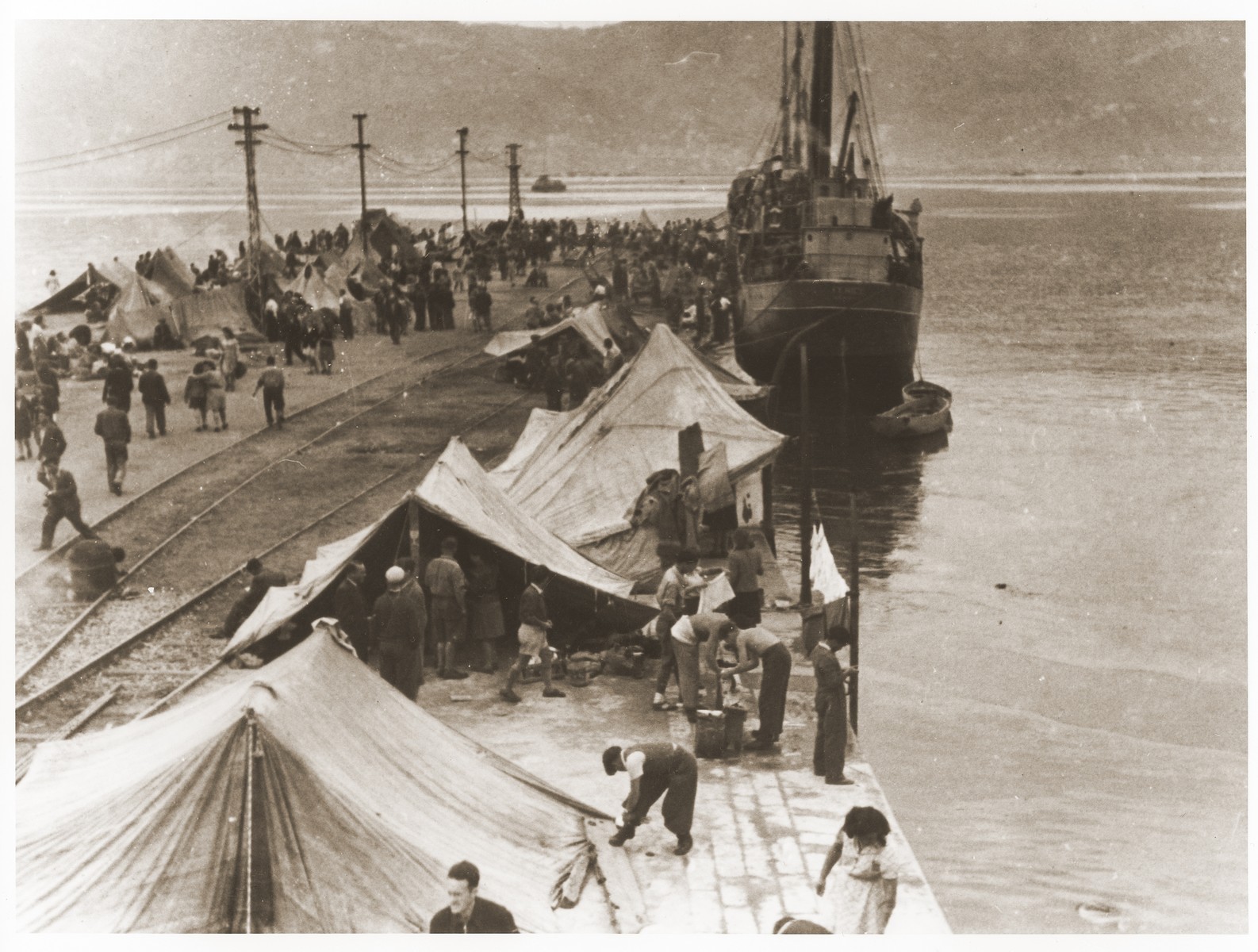 Jewish DPs pitching tents on the pier in La Spezia harbor, where they are holding a hunger strike to protest Britain's refusal to let them sail to Palestine.