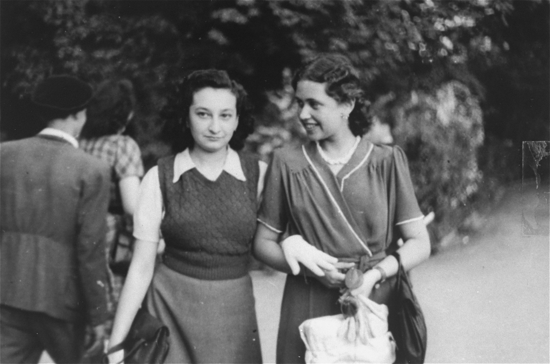 Two Jewish female friends walk in a park in Bucharest just after the liberation.

Pictured are Jeanine Gutman (left) with her friend Valerie Zigmund.