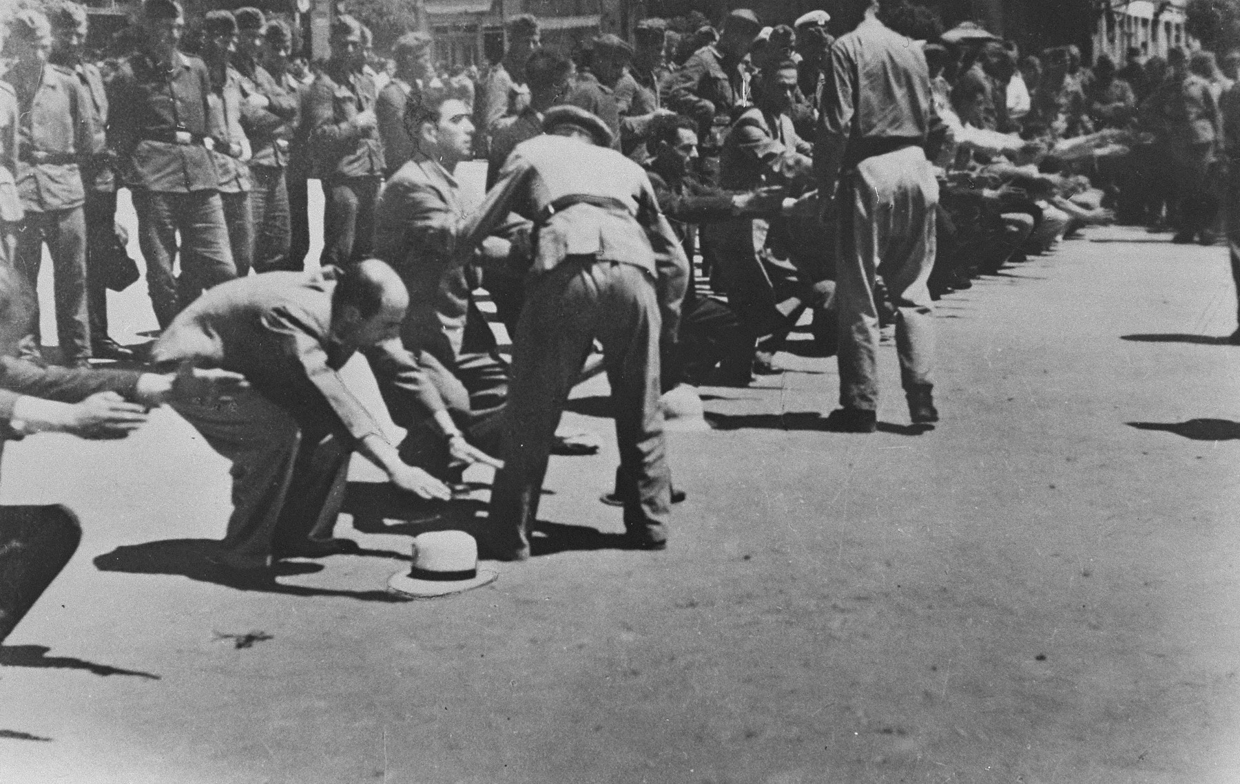 German soldiers force a group of Jews to perform calisthenics on Eleftheria (Freedom) Square in Salonika.