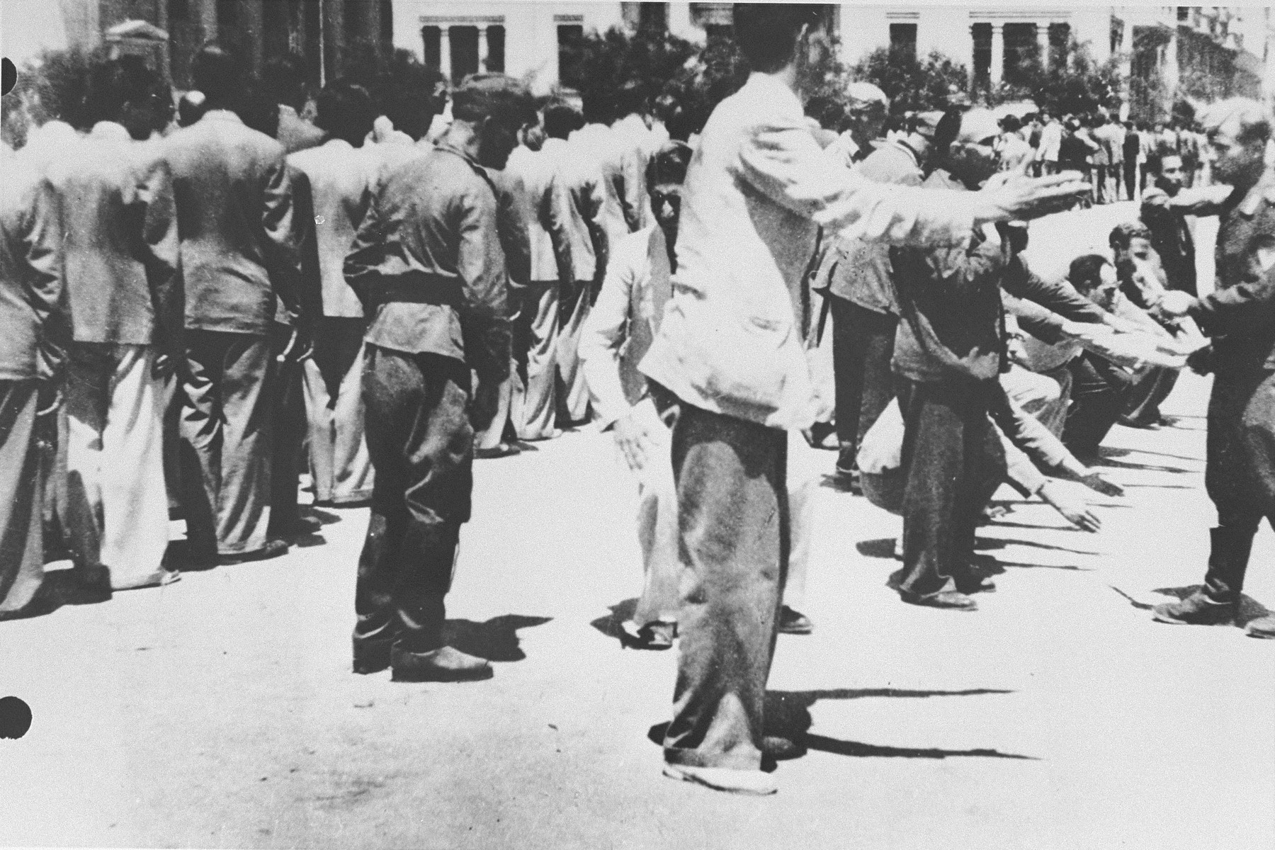 German soldiers force a group of Jews to perform calisthenics on Eleftheria (Freedom) Square in Salonika.