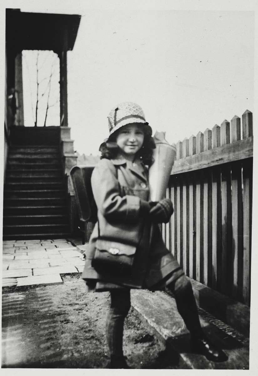 Gitta Possner carries a cone of sweets on her first day of school.