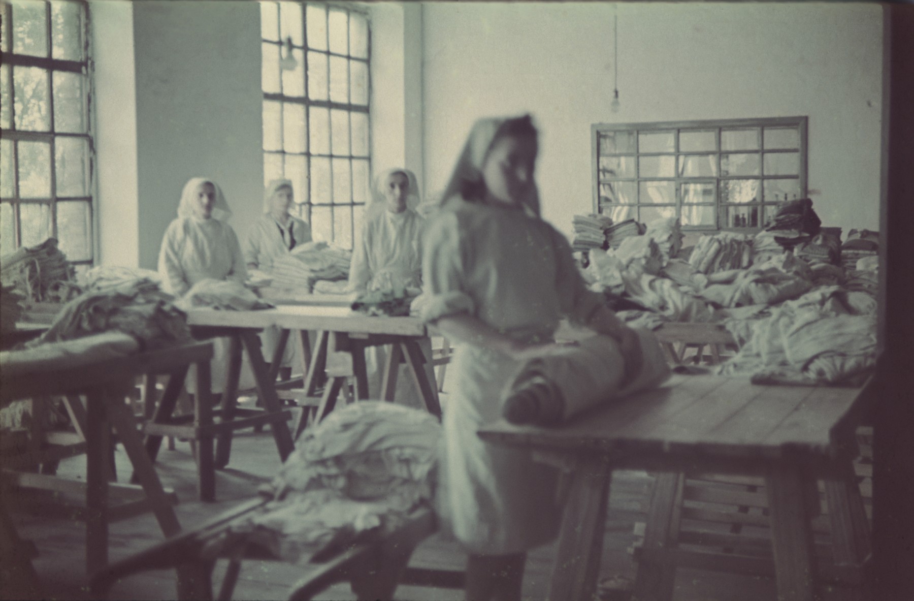 Women work in the ghetto laundry.