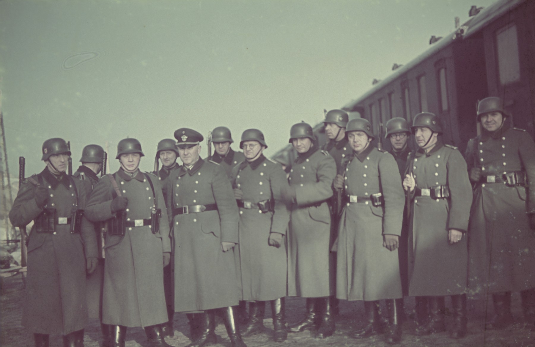 A unit of deportation police (Evakuierungspolizei) poses in the Lodz ghetto in the spring of 1942.

Original German caption: "Evakueringspolizei" (deportation police), spring 1942, #128 (number somewhat blurred and hard to read.)