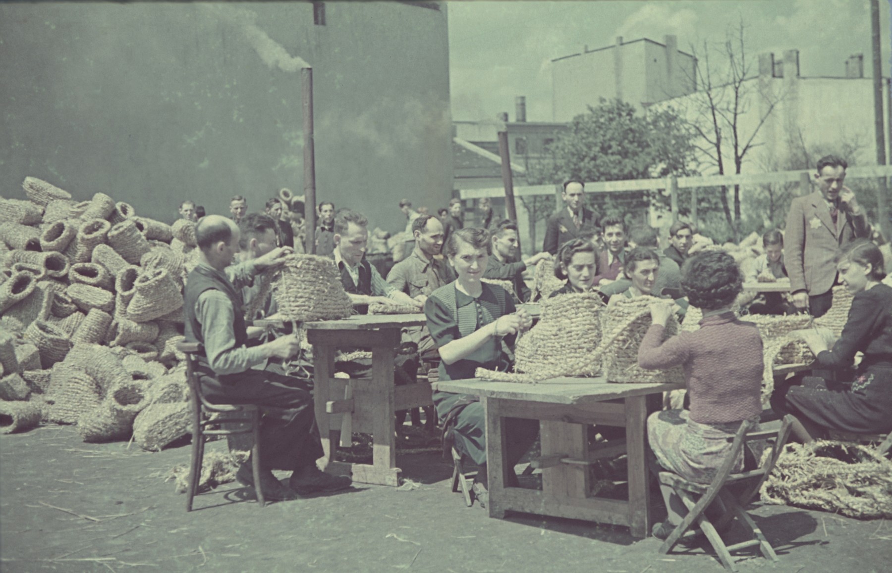 Workers Roll Up Coils Of Straw In The Straw Shoe Factory Of