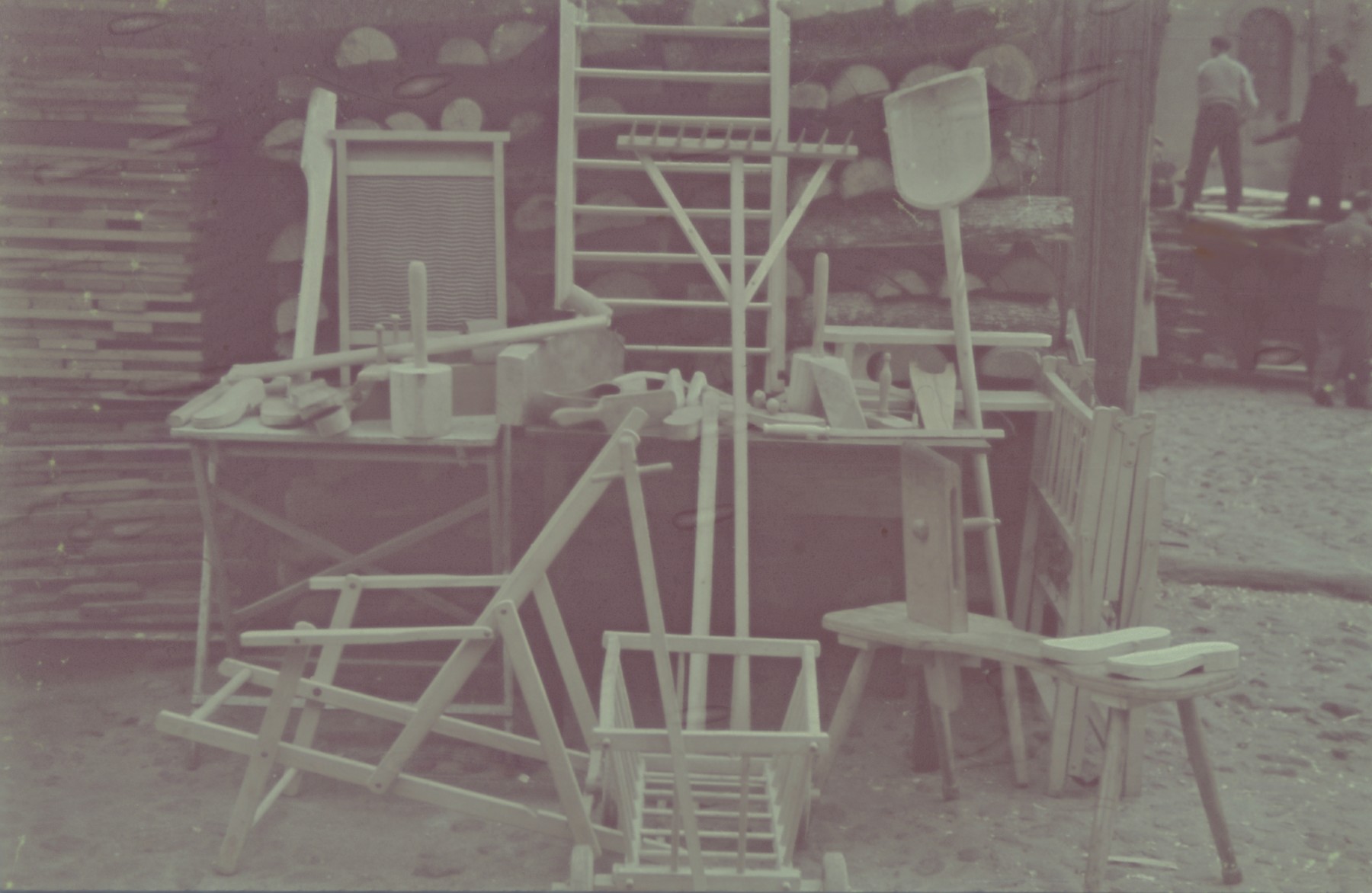 A display of products produced in the Lodz ghetto carpenter's shop.

Original German caption: "Litzmannstadt getto, Erzeugnisse der Holzwerkstaetten" (products of  the wood workshop), #14.
