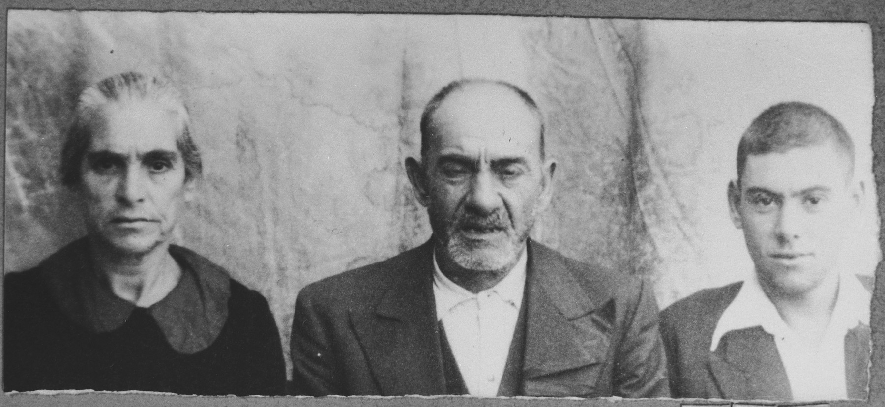 Portrait of Yakov Mishulam, his wife, Reina, and his son, Lazar.  Yakov was a laborer and Lazar, a student.  They lived at Orizarska 1 in Bitola.