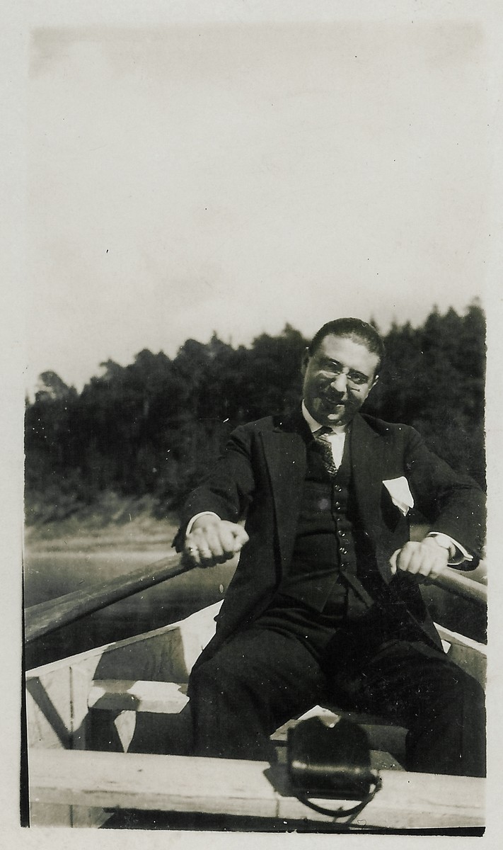 Moisei Kopelman rows a boat down a river near Kaunas, Lithuania.