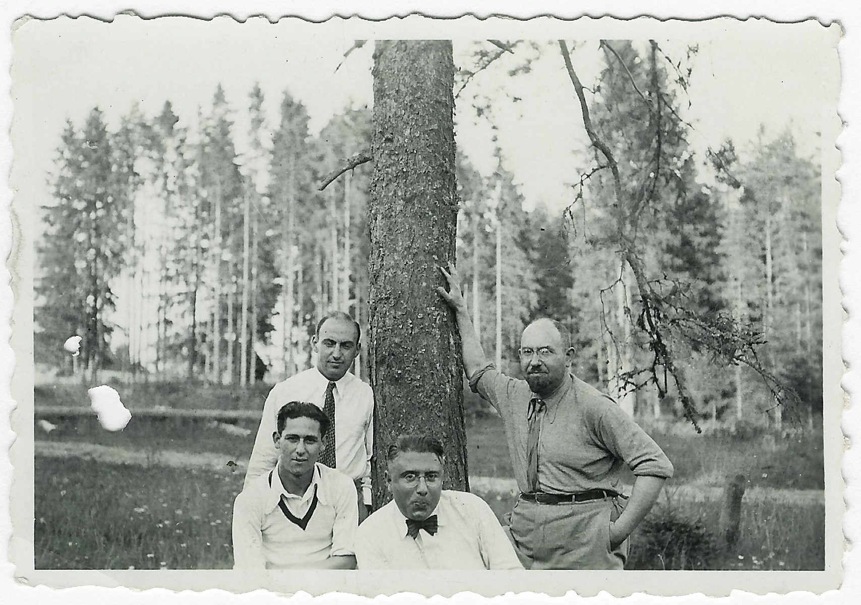 Four Lithuanian-Jewish friends gather in a park near Birstonas.

Among those pictured are Moisei Kopelman (seated right) and Dr. Benjamin Zacharin (standing far right.)  Dr. Zacharin later became head of health department of the Kovno ghetto.