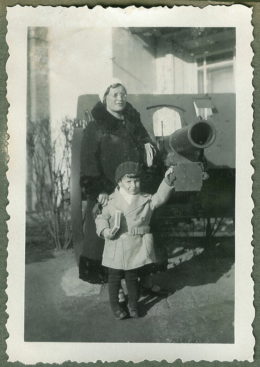 Dmitri Kopelman and his nanny, Nadezhda Jakubovskaja visit a war memorial in downtown Kaunas.