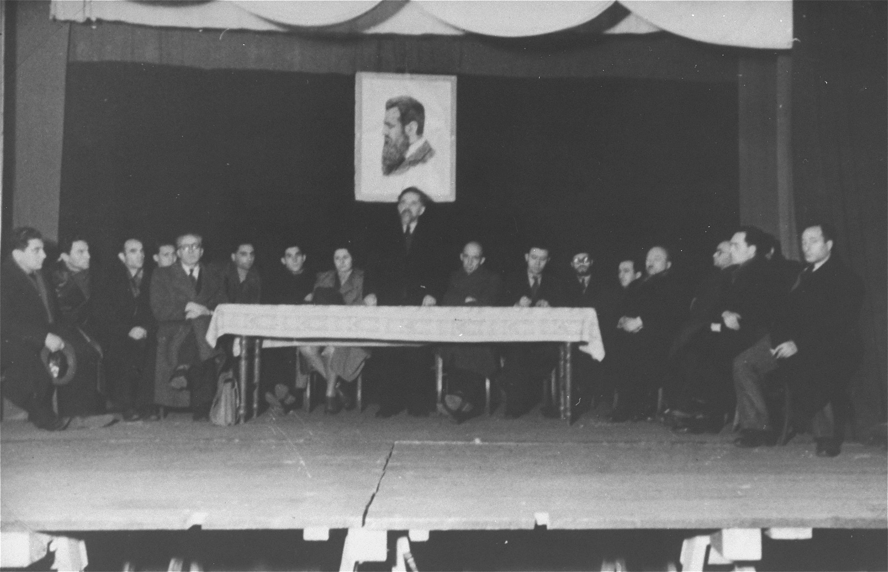 Yitzhak Gruenbaum delivers a speech at a Zionist meeting during his visit to the Zeilsheim displaced persons camp.