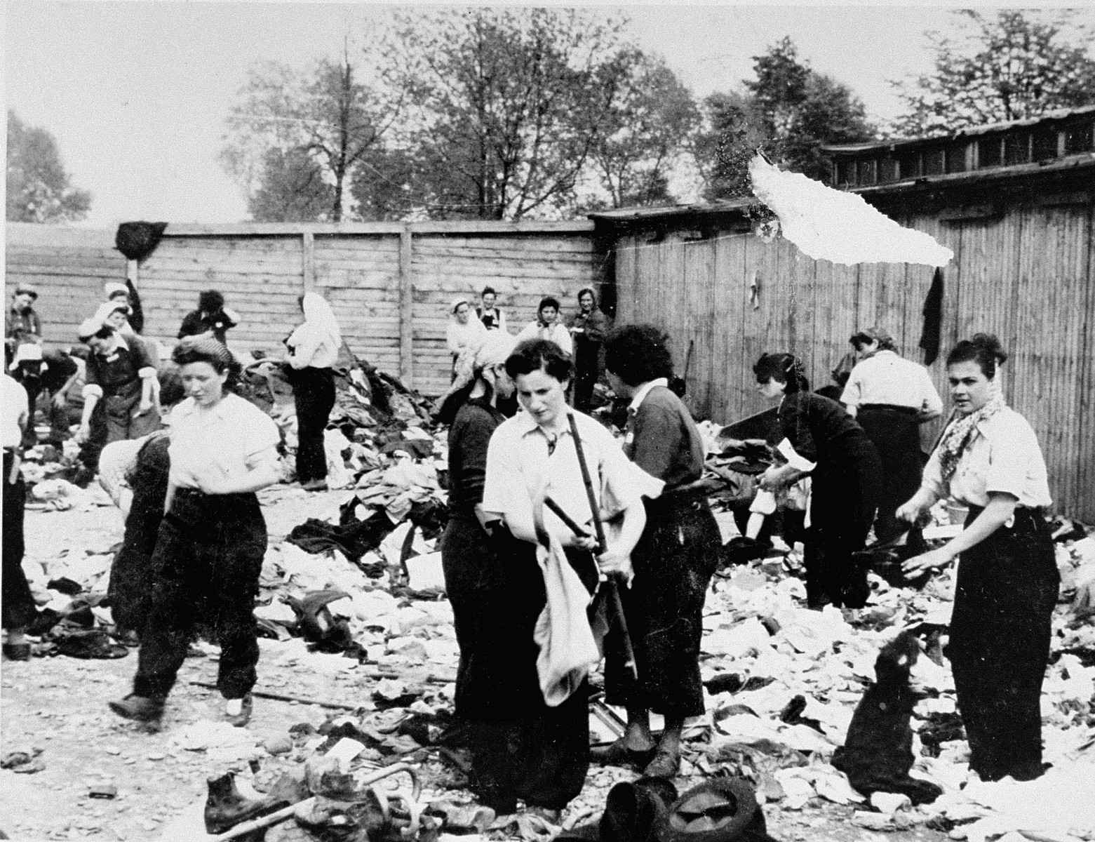 Female prisoners in the Aufräumungskommando (order commandos) sort the confiscated property of a transport of Jews from Subcarpathian Rus at a warehouse in Auschwitz-Birkenau.

The camp prisoners came to refer to the looted property as "Kanada," associating it with the riches symbolized by Kanada.  The members of this commando were almost exclusively Jews.  "Kanada" storage facilities occupied several dozen barracks and other buildings around the camp.  The looted property was funneled from Auschwitz through an extensive distribution network that served many individuals and various economic branches of the Third Reich.