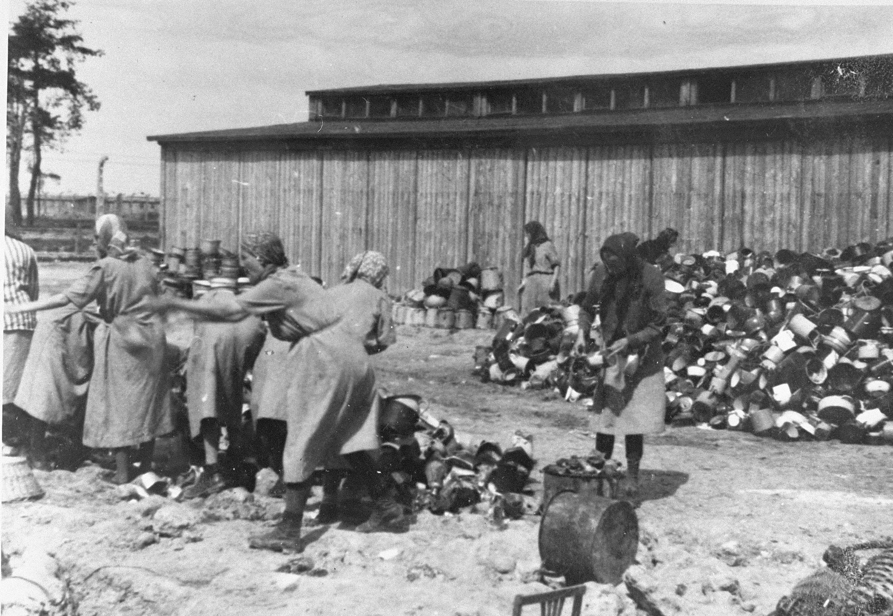 Prisoners in the Aufräumungskommando (order commandos) sort the confiscated property of a transport of Jews from Subcarpathian Rus at a warehouse in Auschwitz-Birkenau.

The camp prisoners came to refer to the looted property as "Canada," associating it with the riches symbolized by Canada.  The members of this commando were almost exclusively Jews.  "Canada" storage facilities occupied several dozen barracks and other buildings around the camp.  The looted property was funneled from Auschwitz through an extensive distribution network that served many individuals and various economic branches of the Third Reich.