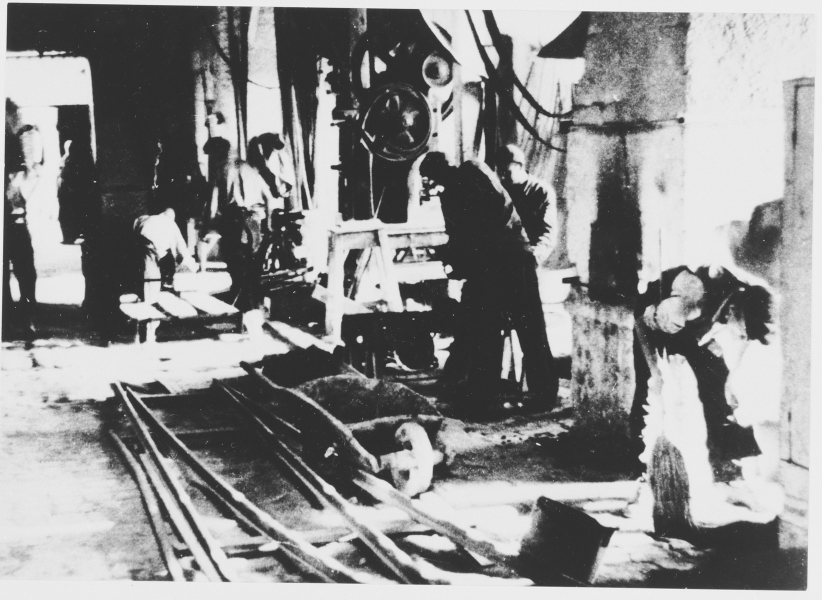 Prisoners labor in a workshop in the Jasenovac III concentration camp.  This photograph was used for propagandistic purposes by the Ustasa.