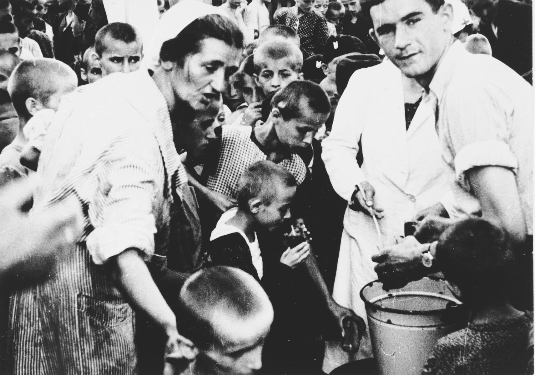 Children are led through a registration process at the Stara Gradiska concentration camp before being transported to Zagreb.