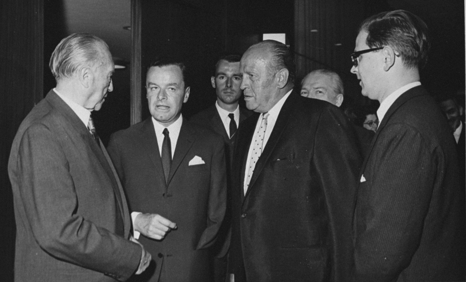 Oskar Schindler (center) with Konrad Adenauer, Chancellor of Germany.

The man in the middle is Germany's first ambassador in Israel, Rolf Friedemann Pauls. Over his left shoulder (to his right in the picture) is his consultant, cultural attache Jörg von Uthmann.