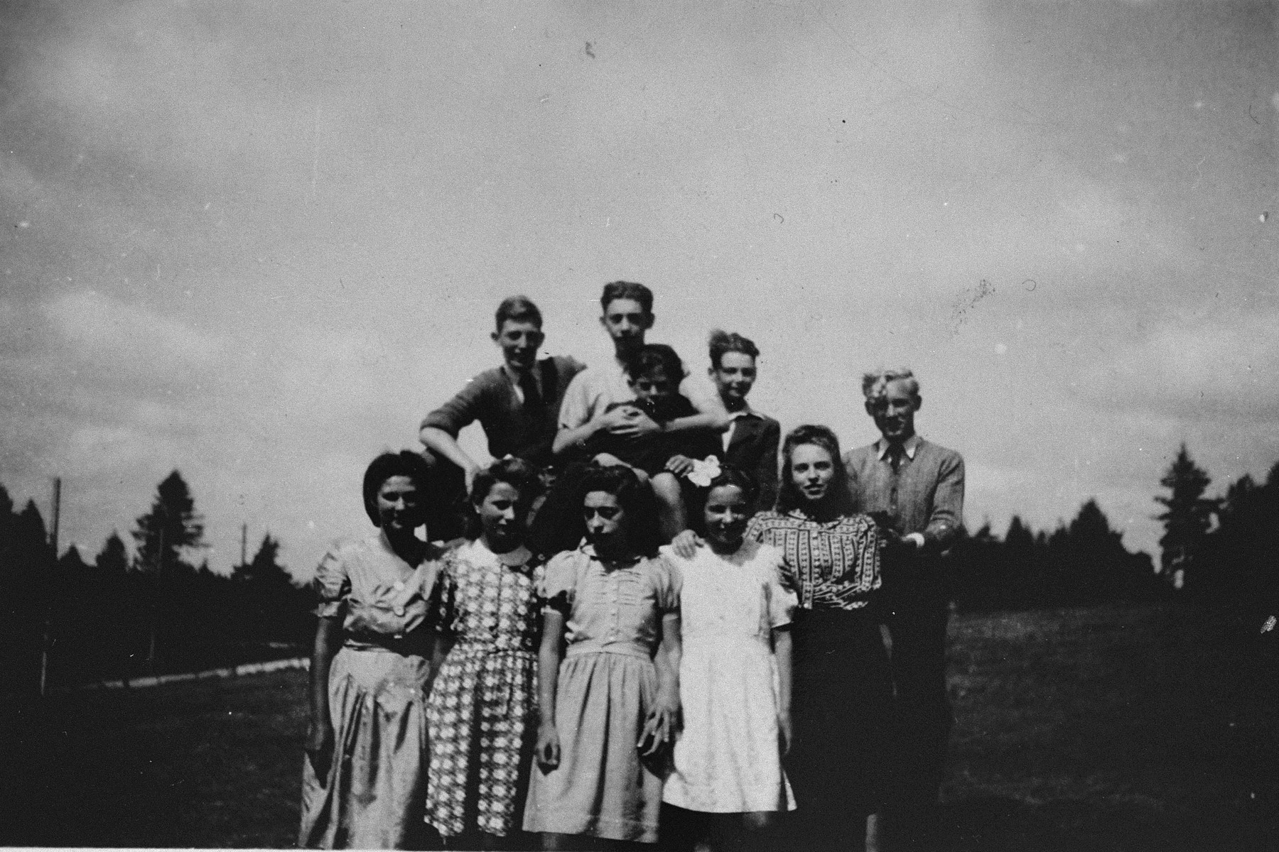 Group portrait of Jewish and non-Jewish refugee children sheltered in various public and private homes in Le Chambon-sur-Lignon during World War II.

Among those pictured are: Antonio Cascarosa (top row, center), a child of Spanish Civil war refugees, Pierre (top row, left), a young deserter from the German army, and an unnamed Czech youth (far right).