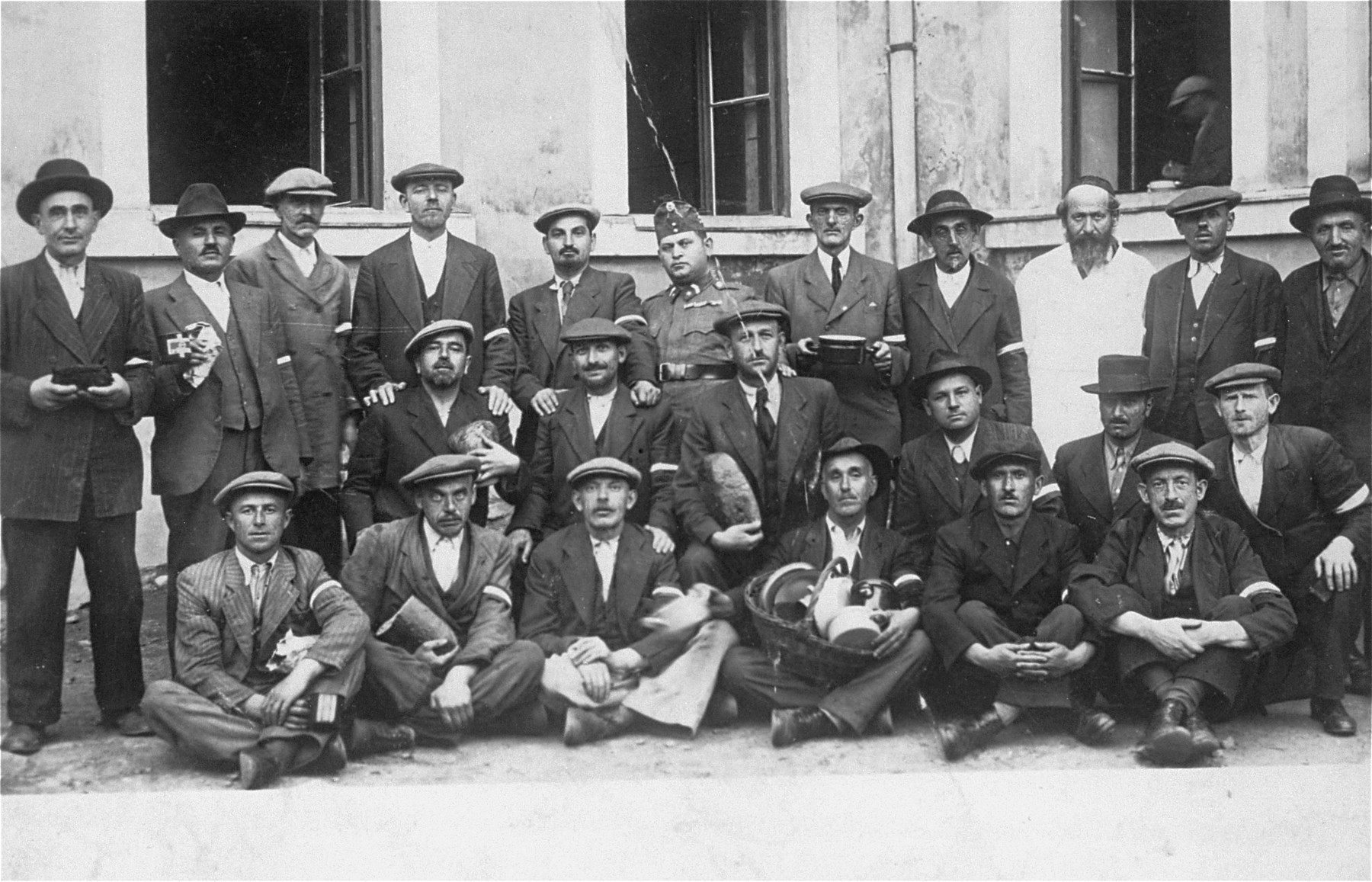 Group portrait of members of an Hungarian Jewish labor battalion in Muckachevo.

Among those pictured is Abraham Ickovic (top row, middle wearing a military uniform), and his younger brother, Itzhak Yaakov Ickovic (next to him on the left).  Few of these men survived the war.