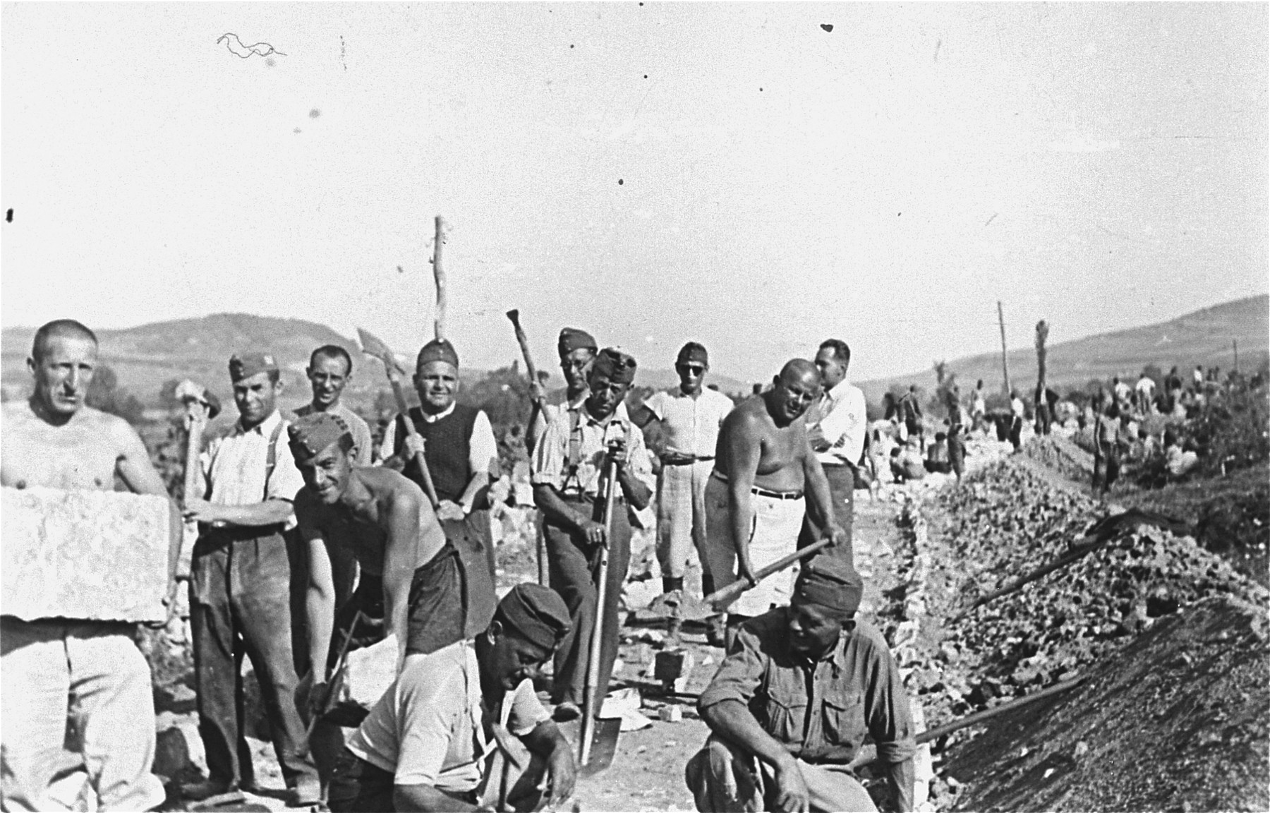 Members of a Hungarian Jewish labor battalion construct a road in Cluj.
