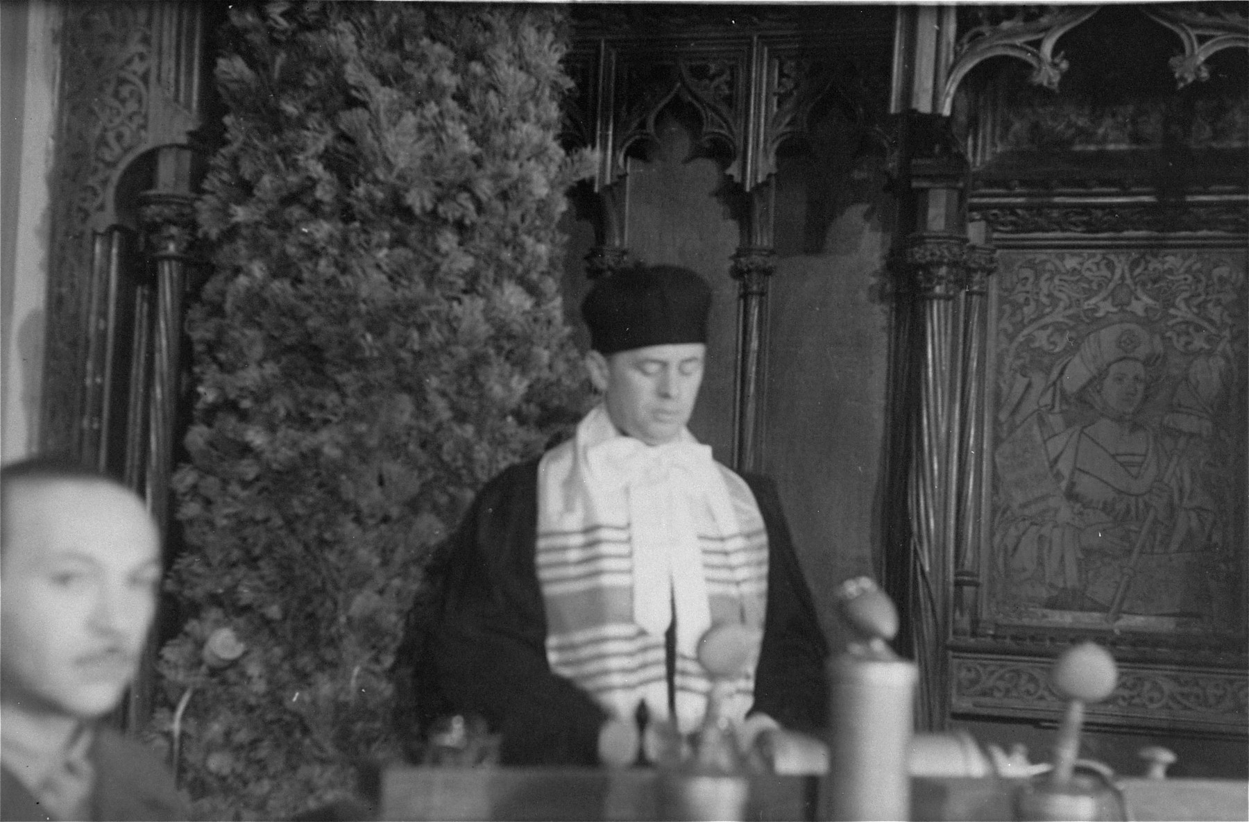 Cantor Schenker says a prayer for the victims of the Holocaust at the first meeting of the Central Committee of Liberated Jews in the U.S. Zone of Germany.
