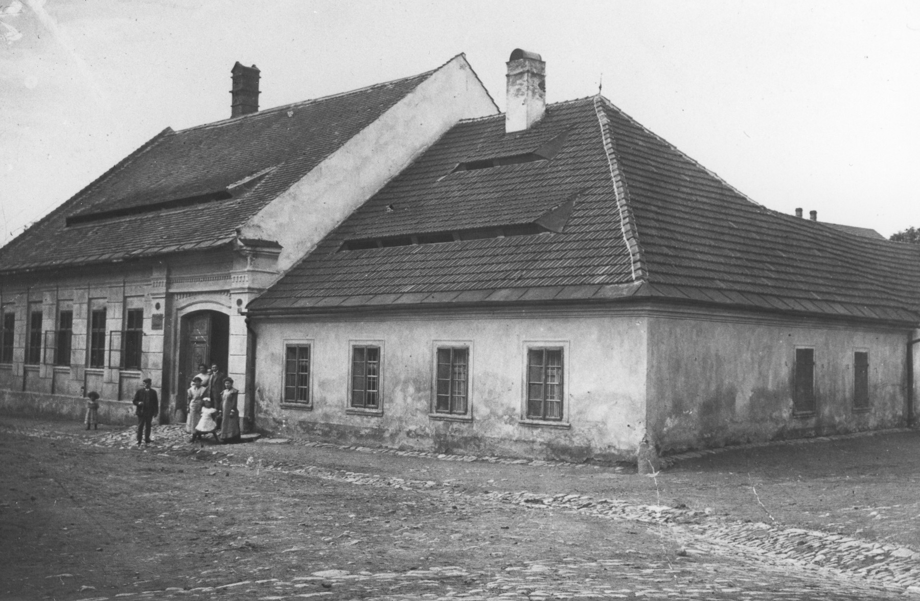 Members of the Schiller family pose outside their home.

The house also functioned as a leather tannery where Viktor Schiller's father worked.