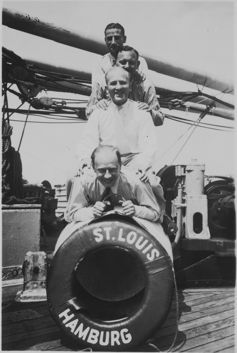 The four friends pose behind a life preserver on deck of the MS St. Louis before its departure from Hamburg. 

Oskar Blechner is at the bottom.