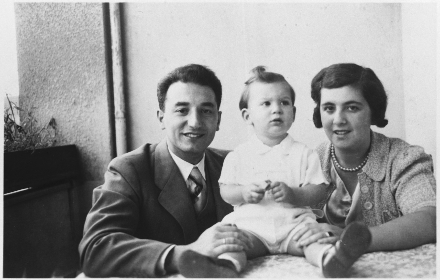 Portrait of the Hirsch family on board the refugee ship MS St. Louis.

Pictured are Max and Margot and their son, Joachim.  They disembarked in the Netherlands and later perished.