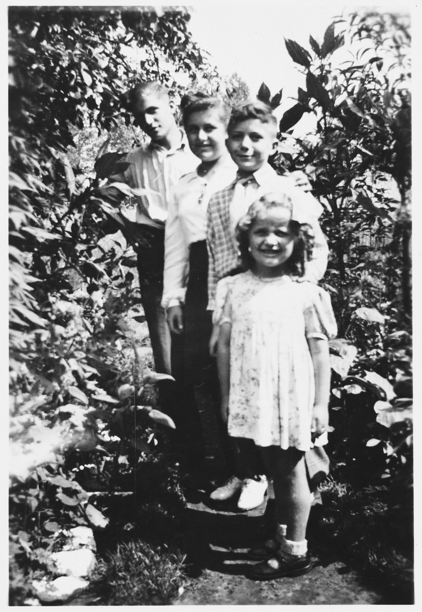 The four Rotenberg siblings pose in a garden while in hiding in Beligium.

From back to front are Wolfgang, Regina, Siegmund and Sonja.