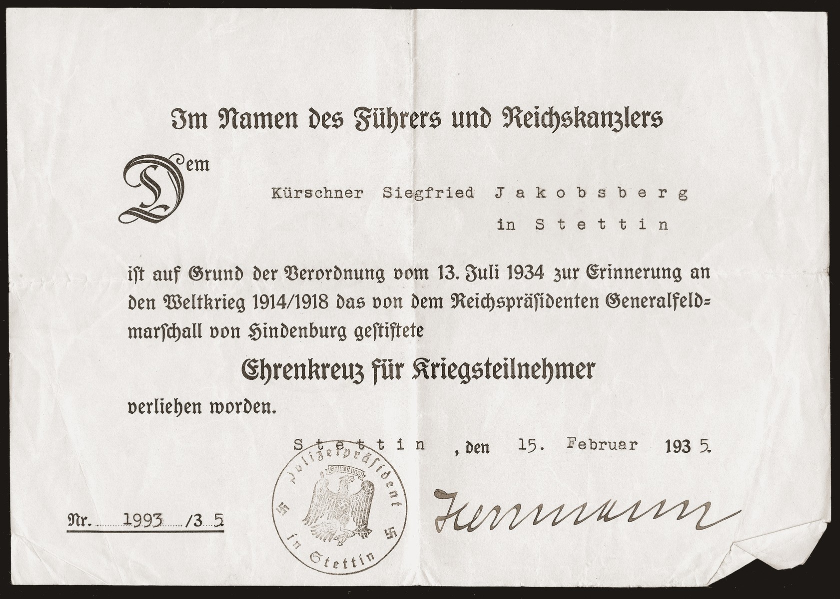 A certificate issued to Siegfried Jacobsberg recognizing him as a World War I veteran and recipient of a medal of honor.