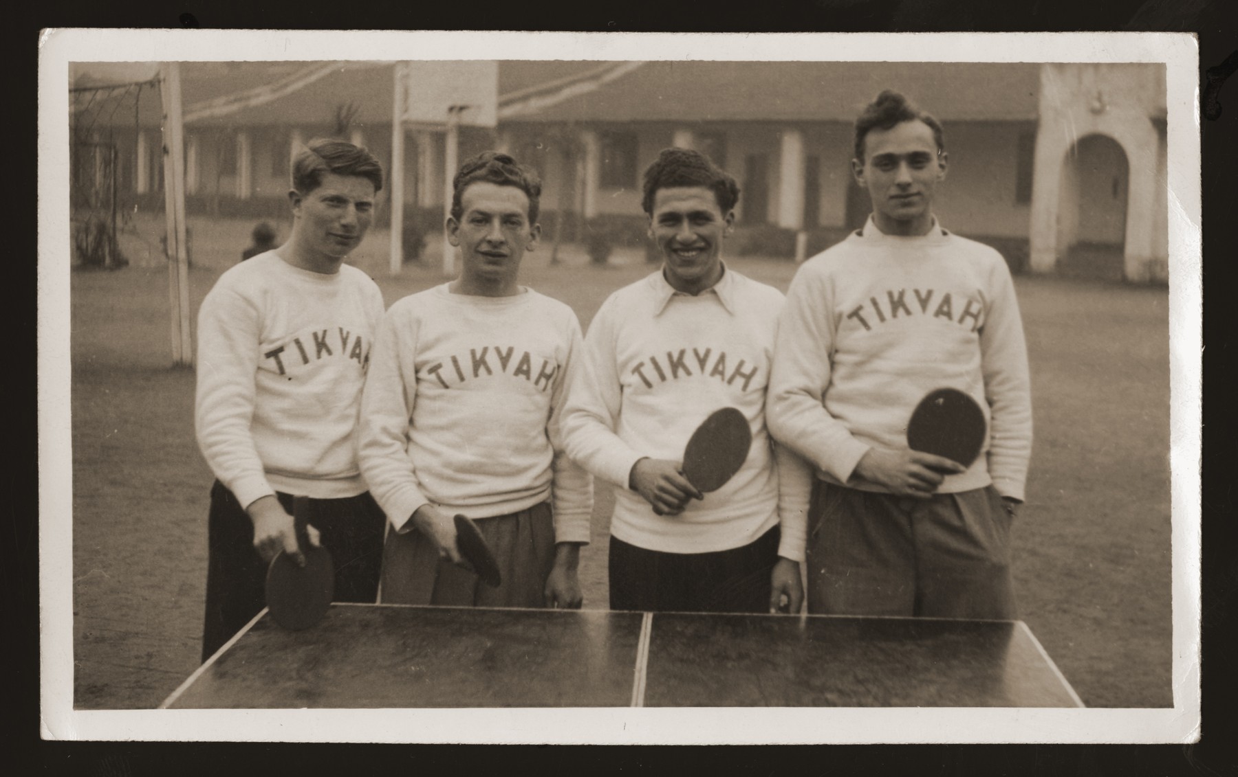 Group portrait of members of the Tikvah ping pong team.  

Pictured from left to right are Ilie Wacs, Werner Rosenberg and Henry Sattler.