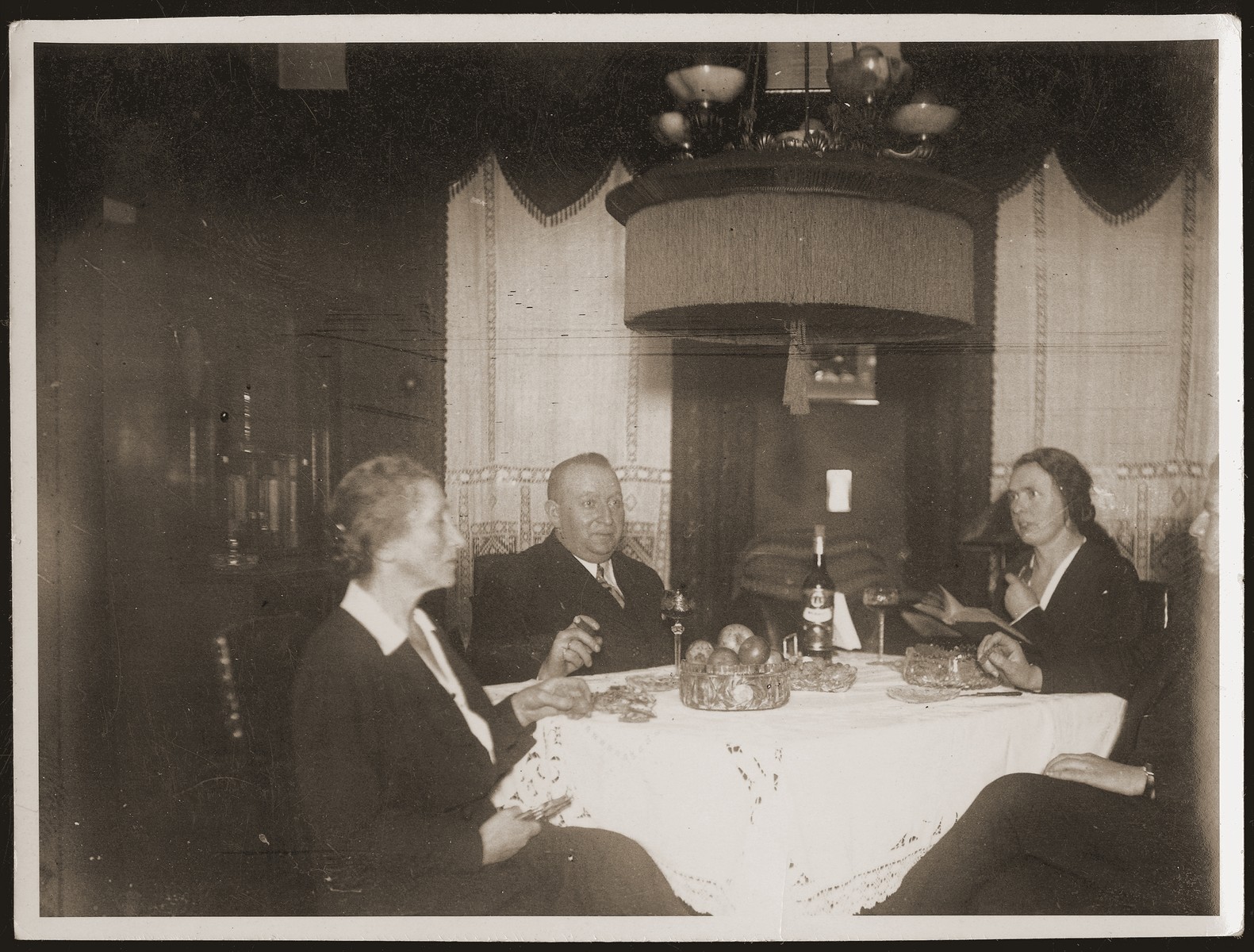 The Jacobsberg family celebrates Christmas with their German maid, Minna.  

Pictured from left to right are Betti and Siegfried Jacobsberg, Minna, and Walter Jacobsberg.