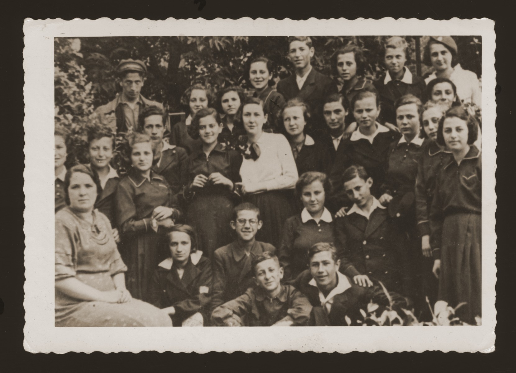 Group portrait of students from the Jewish gymnasium in Zamosc, Poland.

Irene Wechter is pictured is standing in the right front.